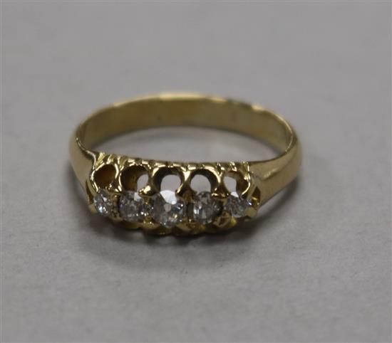 A yellow metal and graduated five stone diamond ring, size K.